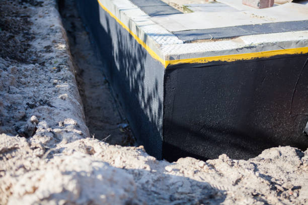 Professional Waterproofing technician working in Oshkosh, WI